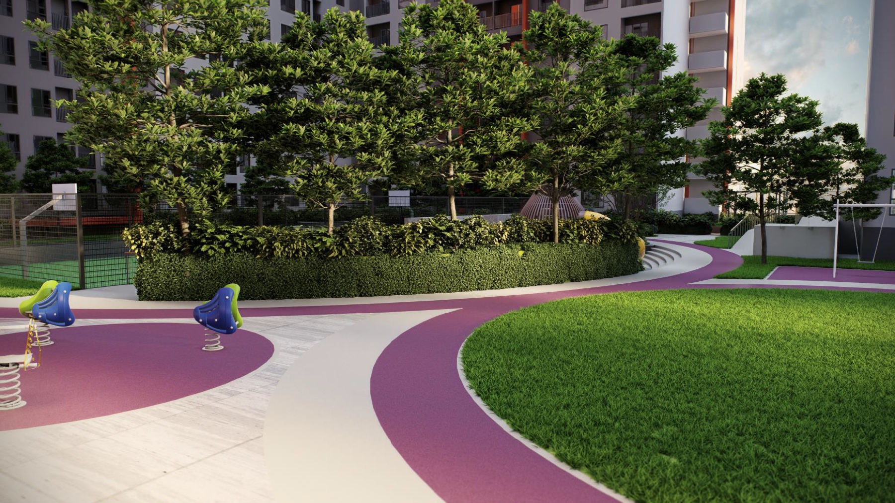 SENA Residences open lawn and garden play area beside the residential towers